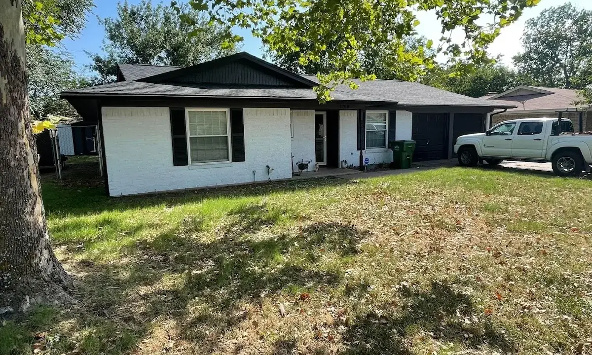 Professional roofing crew working on a residential roof in Storm Lake